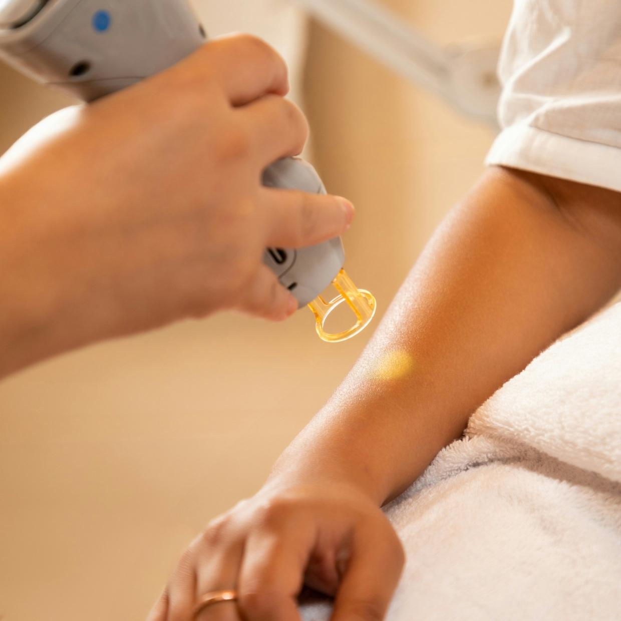 Dermatologist checking skin