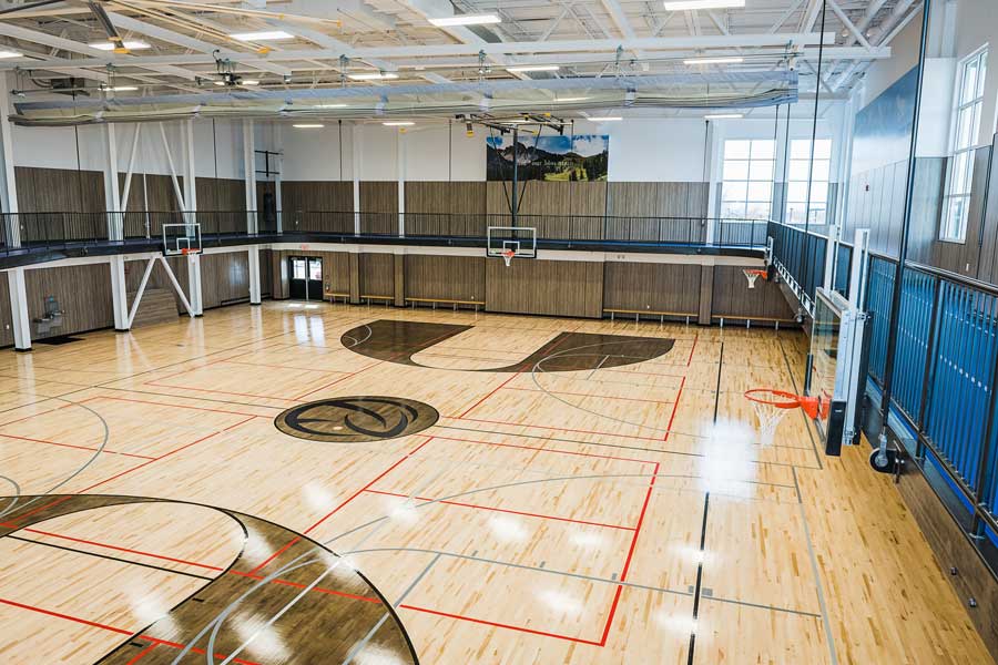 https://ridgeathletic.com/wp-content/uploads/2019/12/gym-facilities-basketball-court-track-ridge.jpg